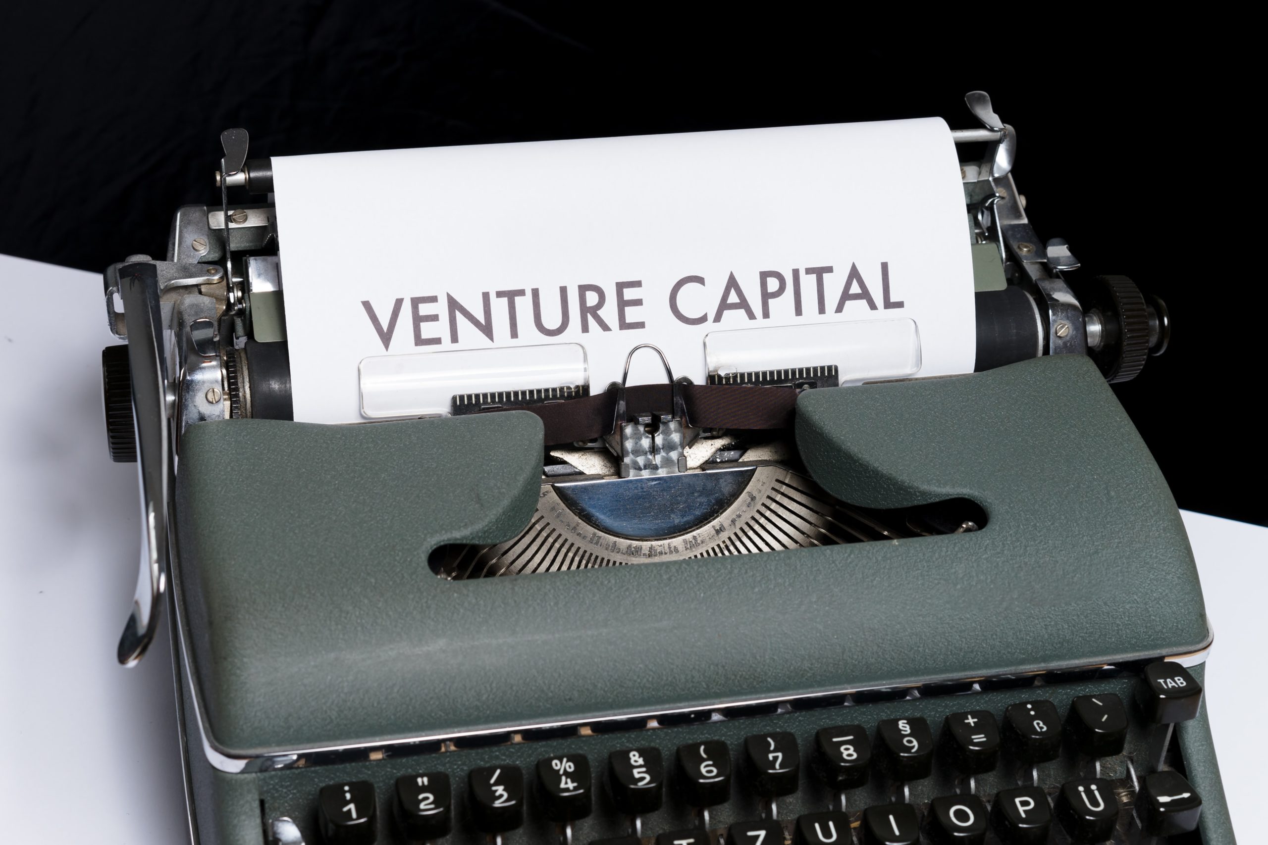 A typewriter typing Venture Capital on a paper