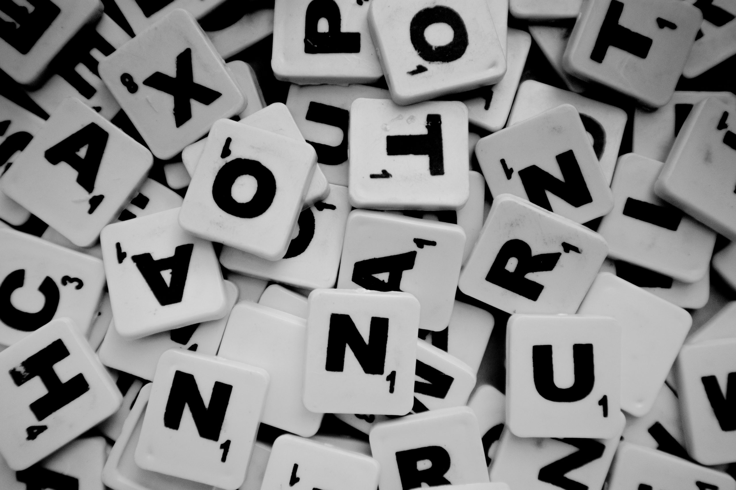 Pile of Scrabble tiles with letters