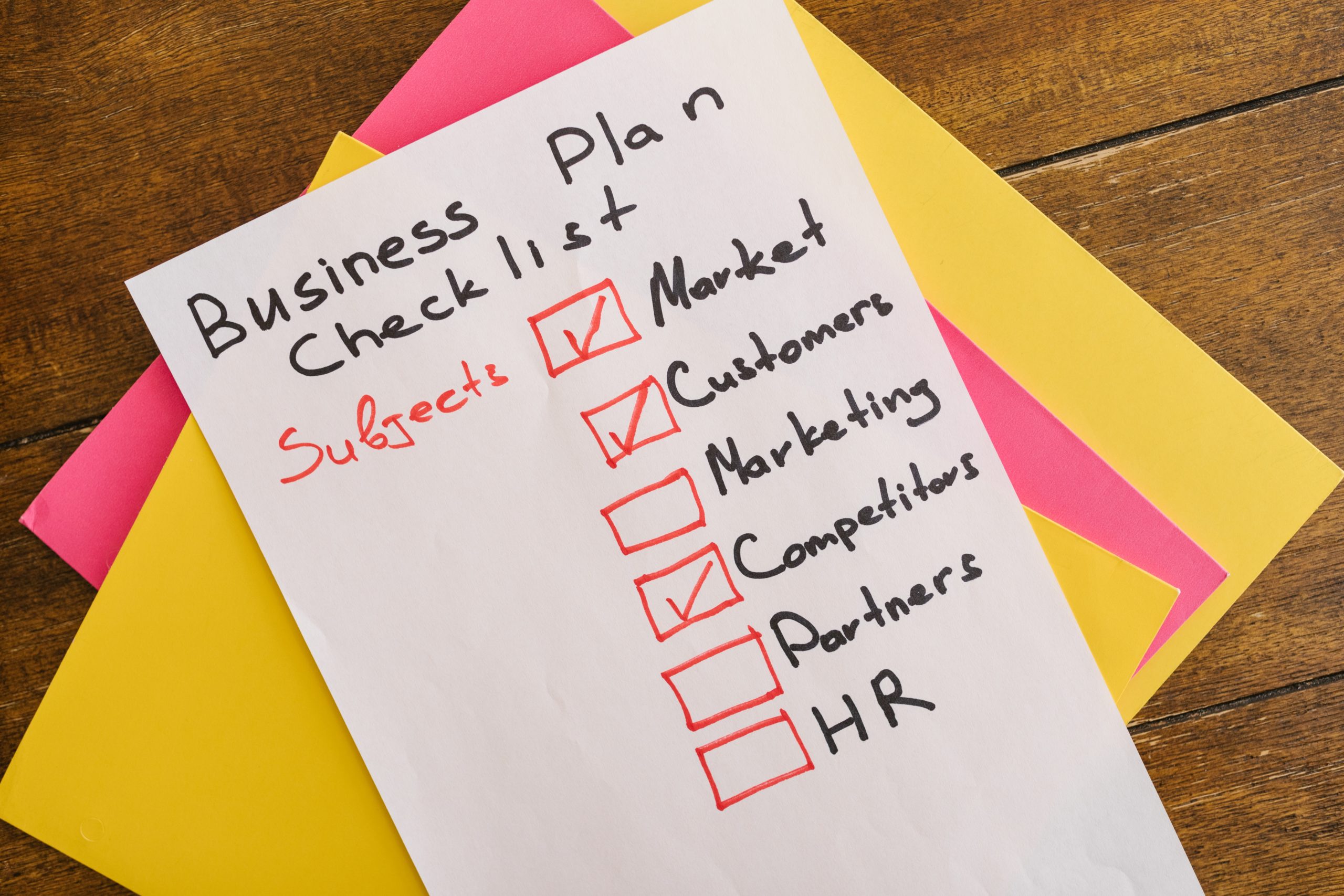 Business plan checklist written on paper