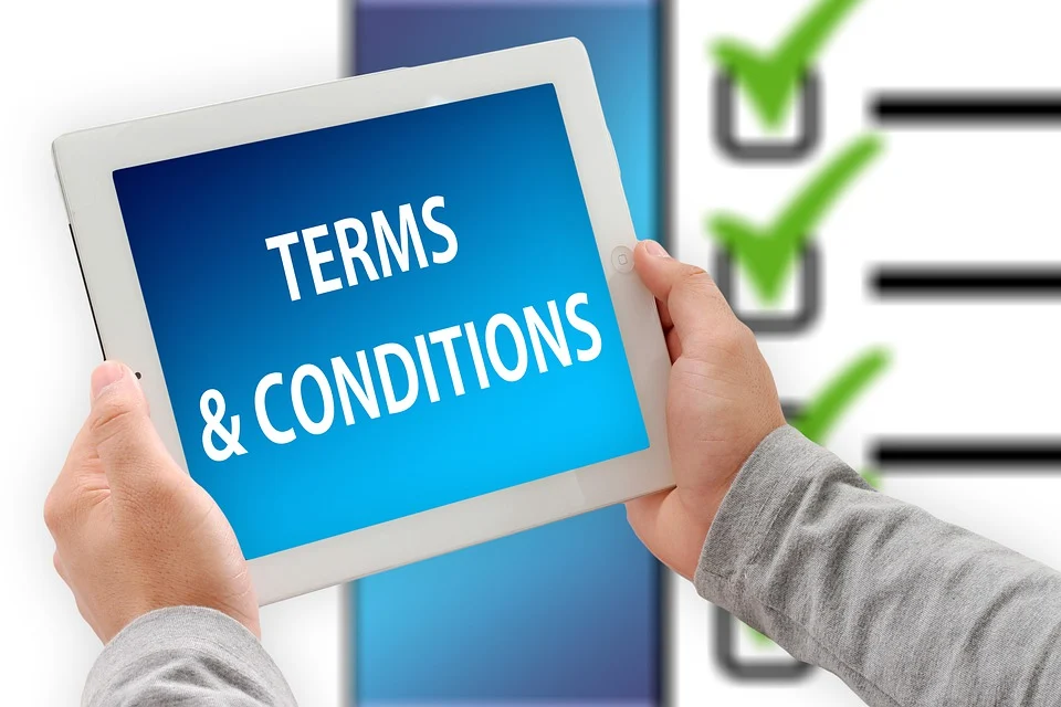 The words “terms and conditions” displayed written on a tablet.