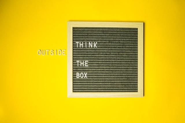 Think outside the box with a yellow backdrop.