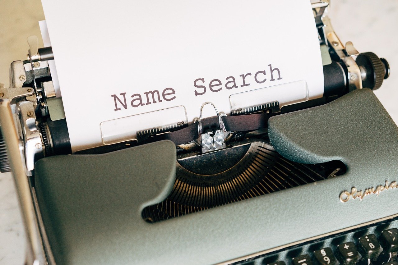 Name search typed on a paper with a typewriter